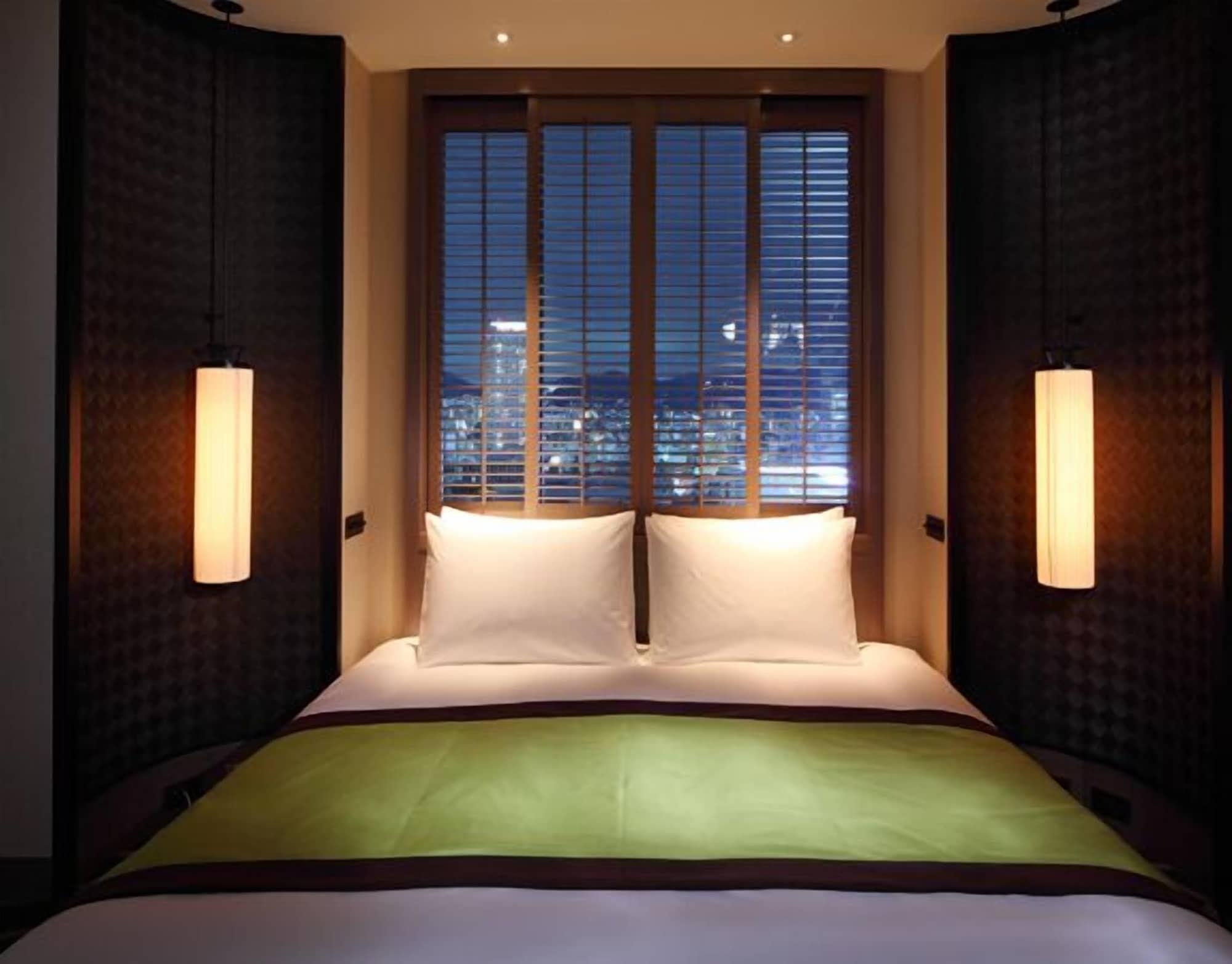 فندق أورينتال كوبه المظهر الخارجي الصورة A bedroom at the hotel